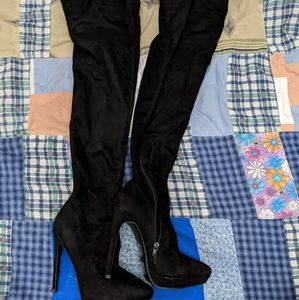 Thigh high heeled boots